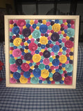 Paper flowers in a shadow box